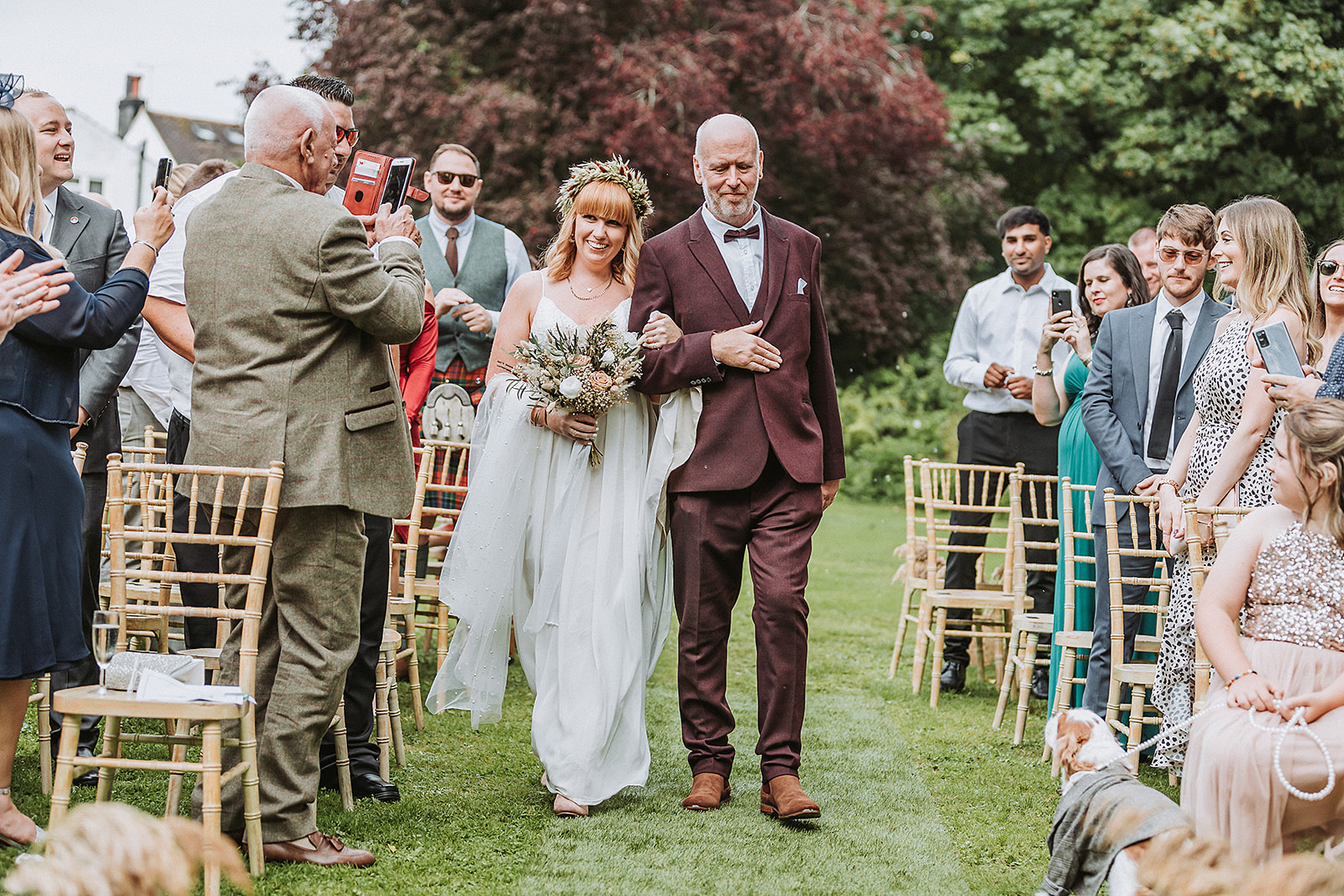 bride and father walking down the aisle at the waterside venue rickmansworth wedding photographer photography Hertfordsh