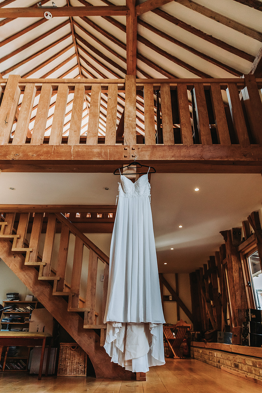 Wedding dress hanging from Springwell Barn, Rickmansworth, wedding photographer photography Hertfordshire  