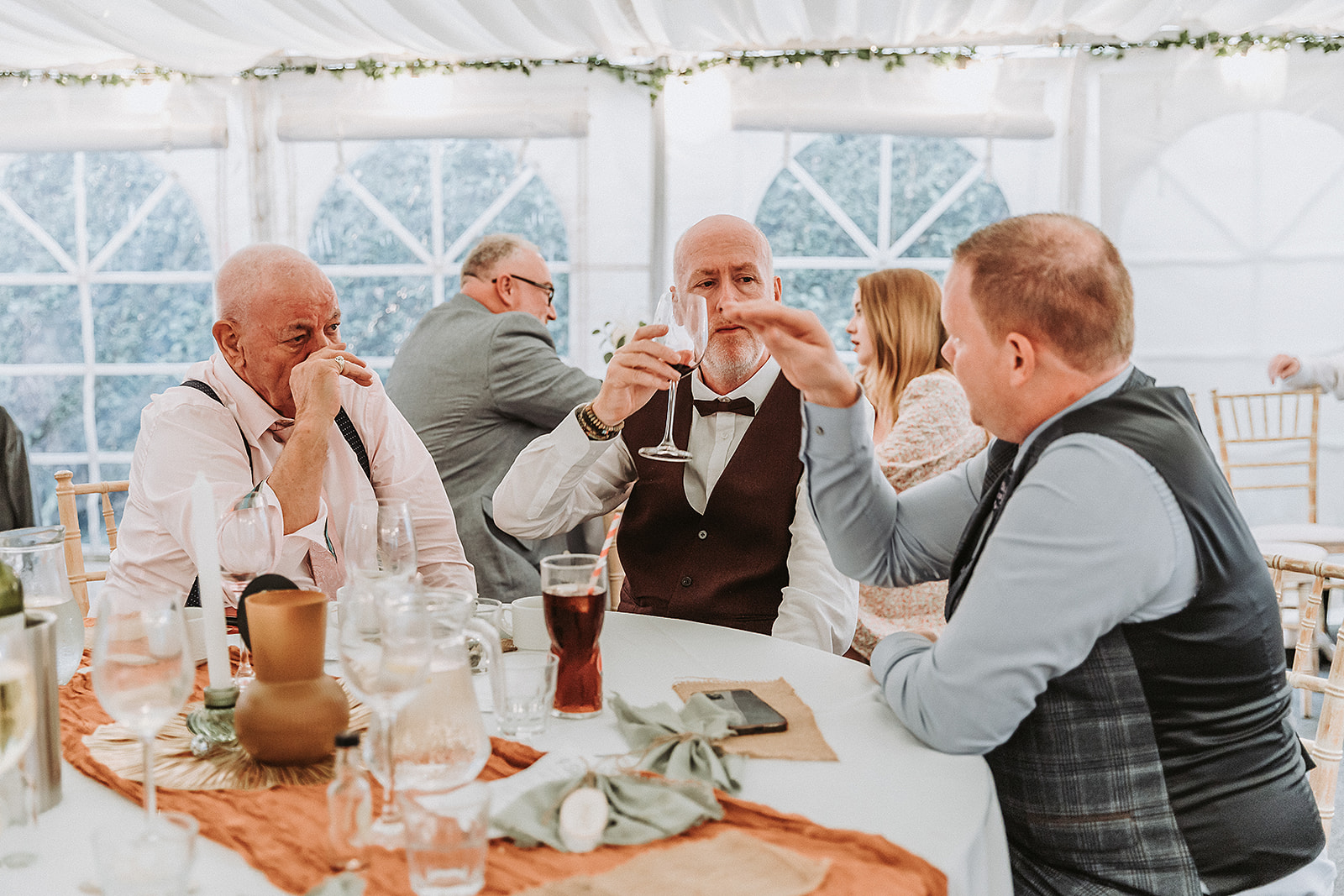 wedding guests toasting at a wedding in the waterside venue rickmansworth wedding photographer hertfordshire