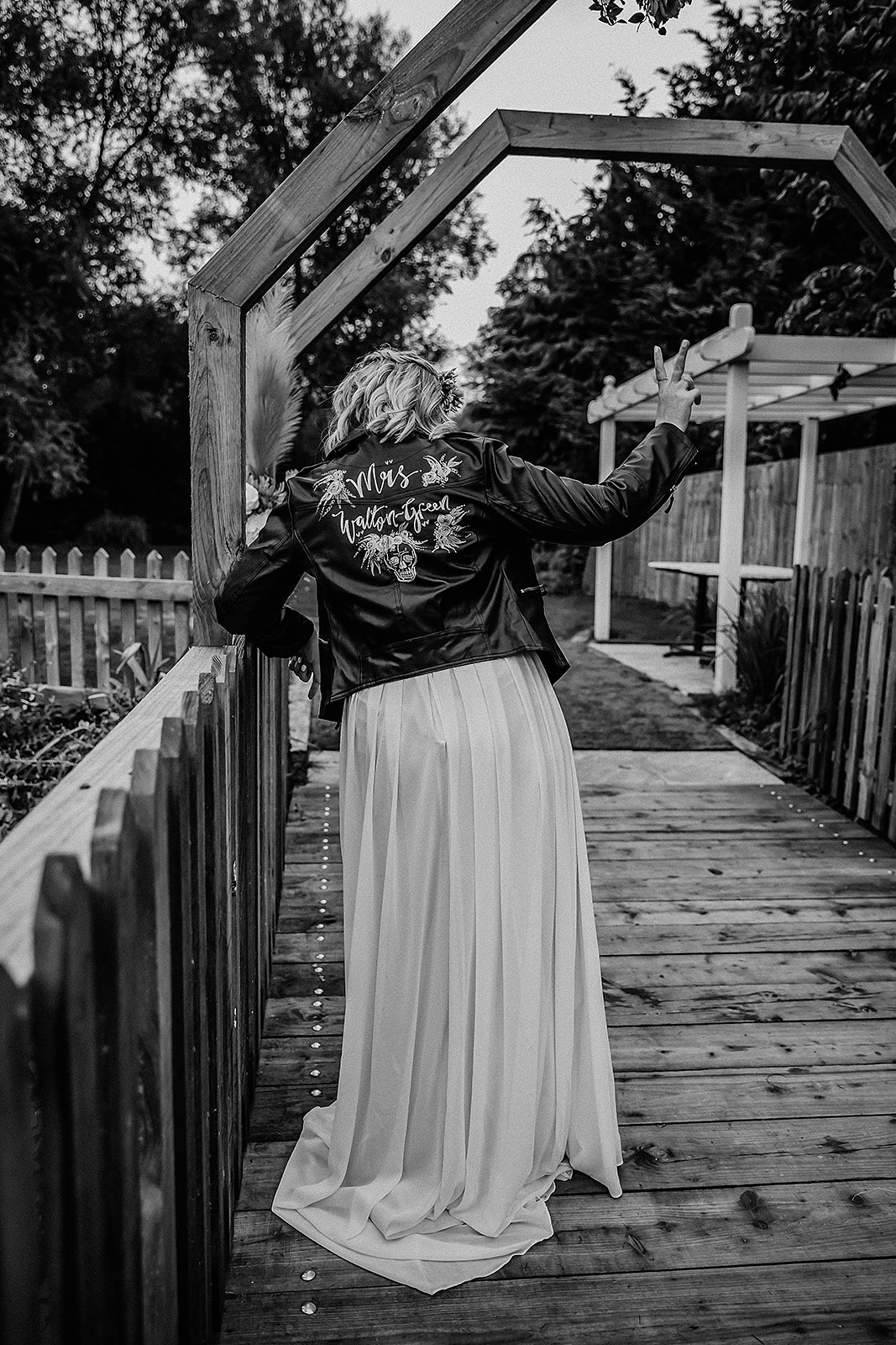 Bride in her new personalised mrs leather jacket The waterside venue rickmansworth wedding photographer photography hert