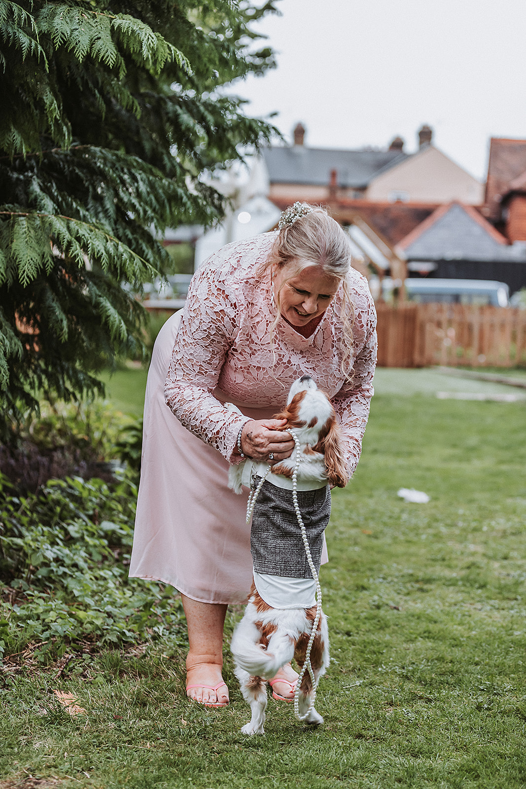 Mother of the bride and dog at wedding in the waterside venue rickmansworth wedding photographer hertfordshire