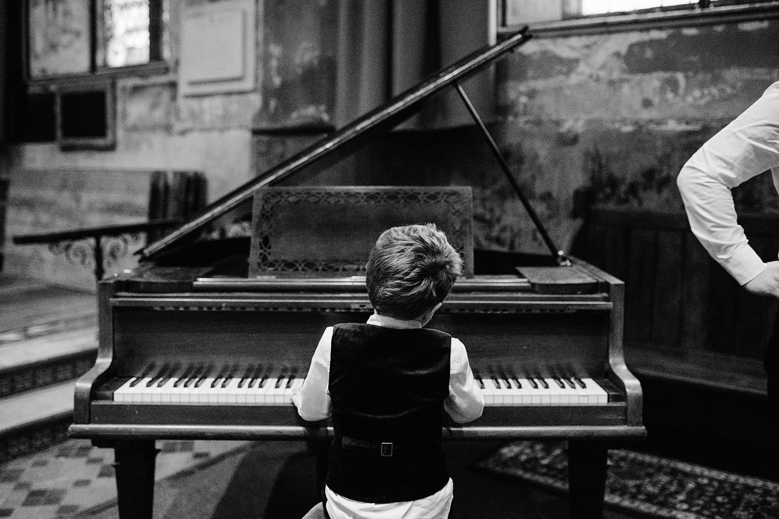candid of child playing piano