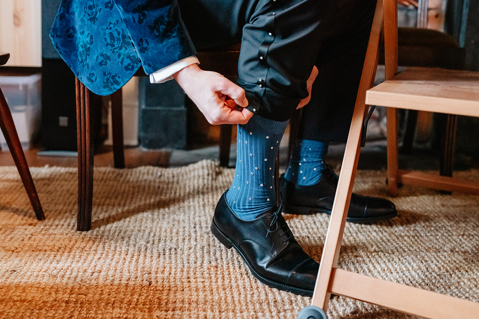 groom showing his socks that have added sparkle on them 