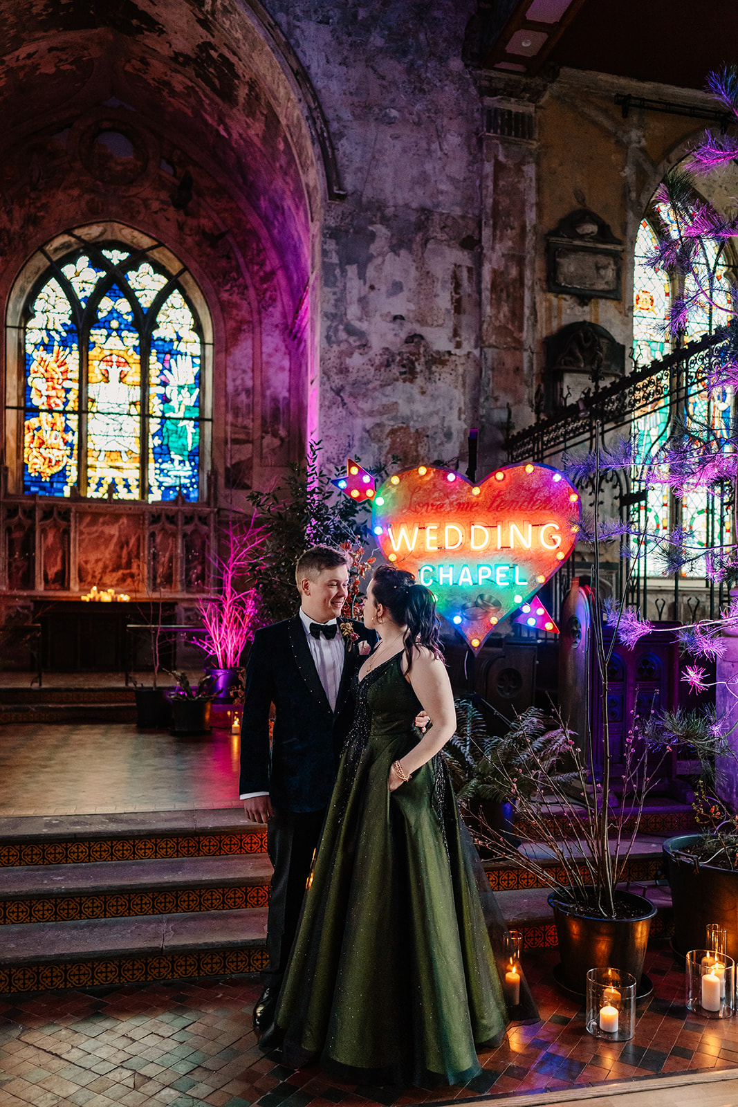 wedding couple in front of a "wedding chapel" neon sign at Mount Without  in bristol
