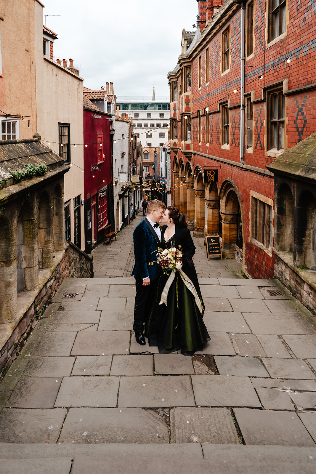 wedding couple kissing on Christmas Steps in Bristol City Centre