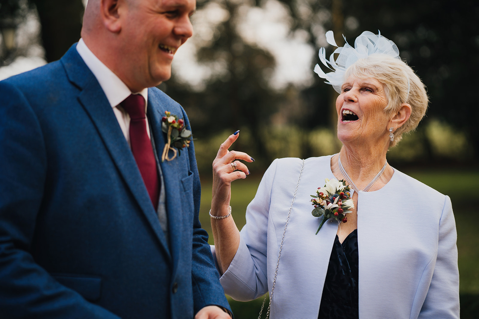 the groom and his mum laughing together