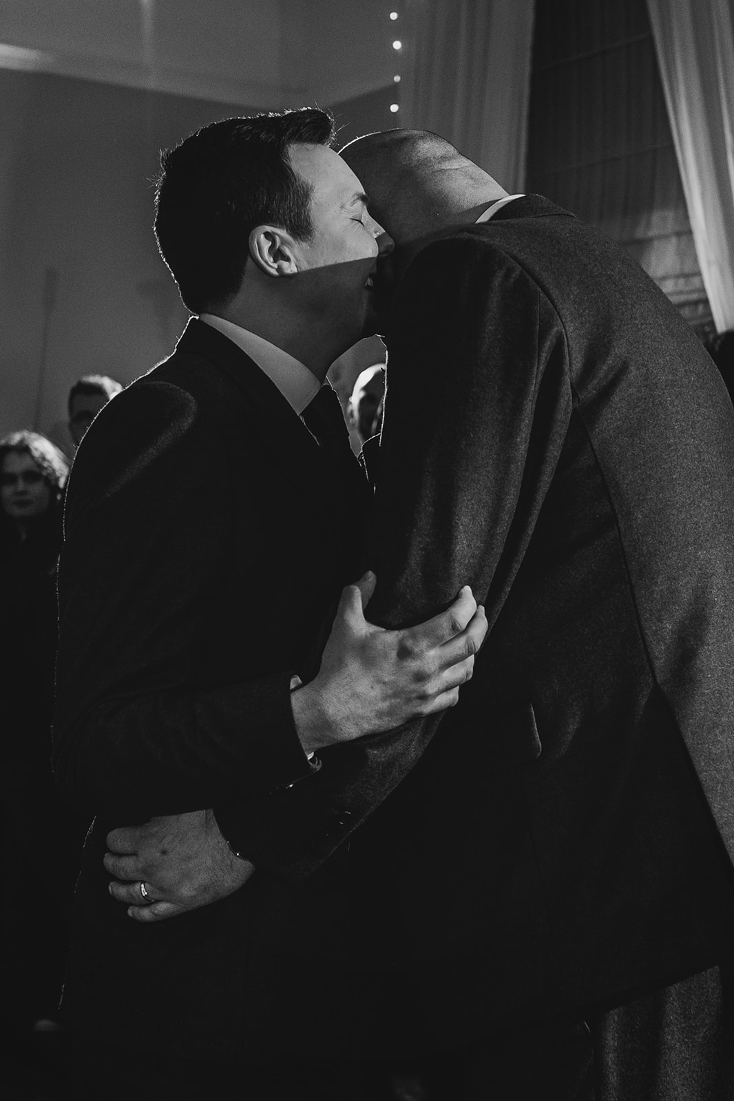 an emotional moment during the first dance as the two grooms hold one another and close their eyes