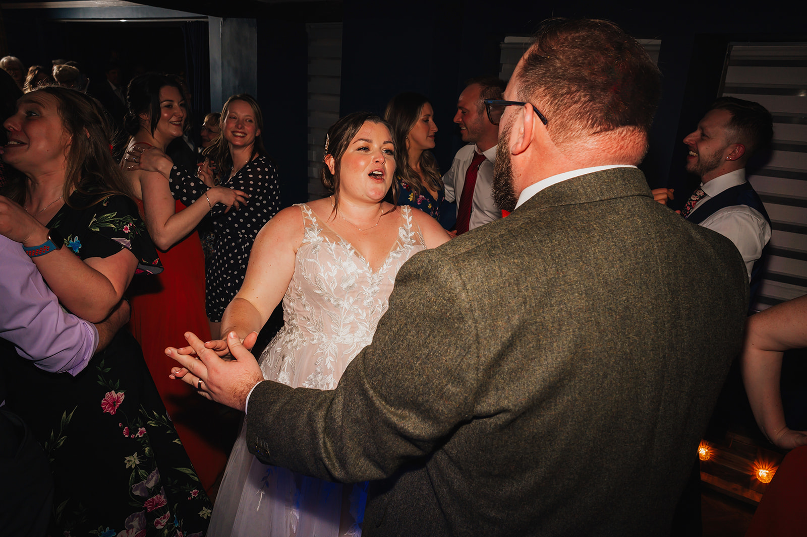 the bride and groom share their first dance