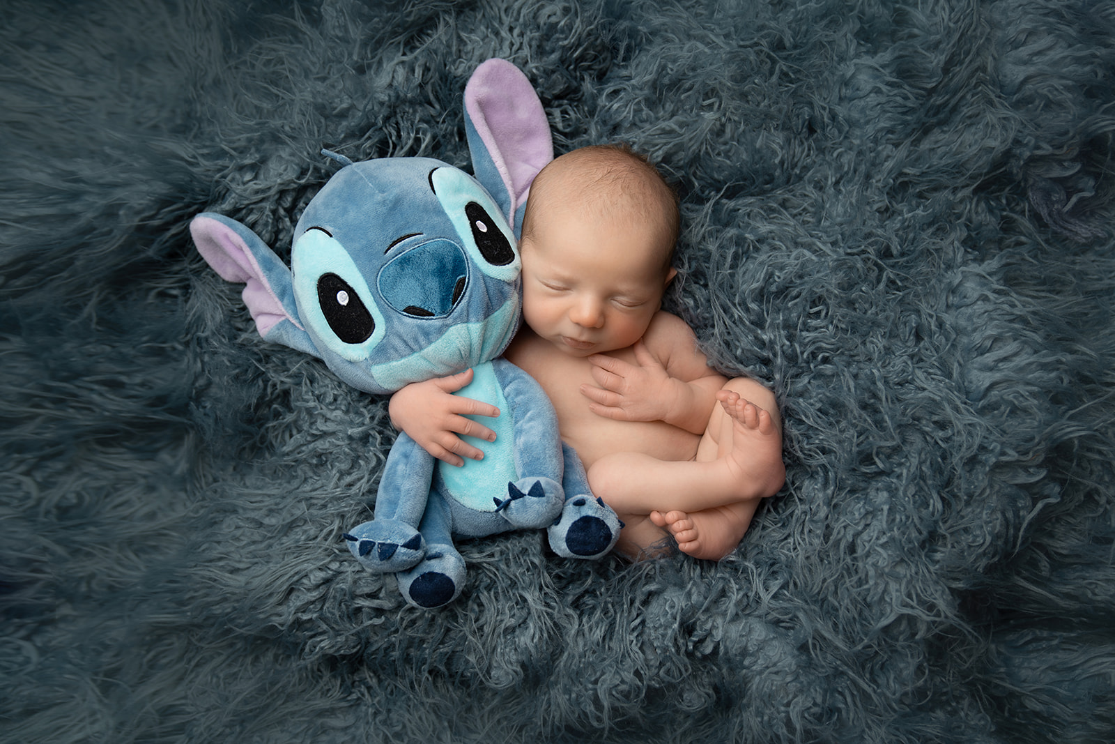 Baby props and toys with your newborn.