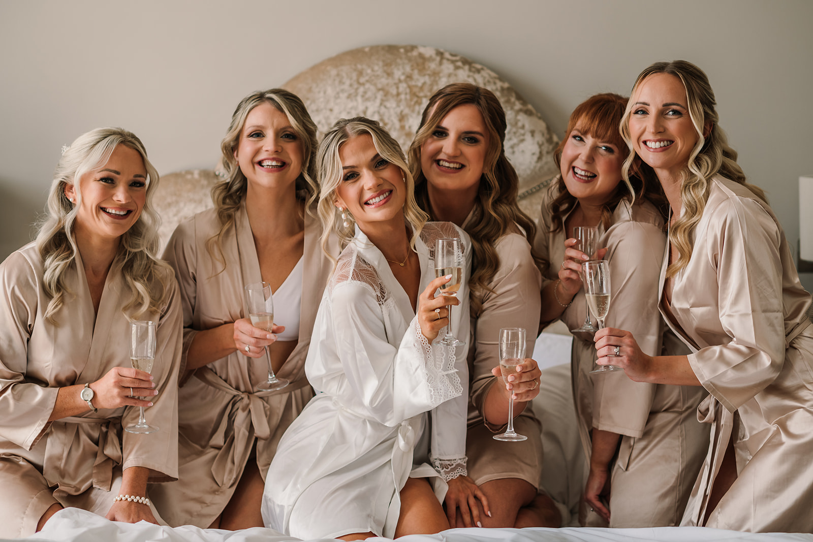 Wedding photography of Bride and bridesmaids toasting at Kings Arms Hotel