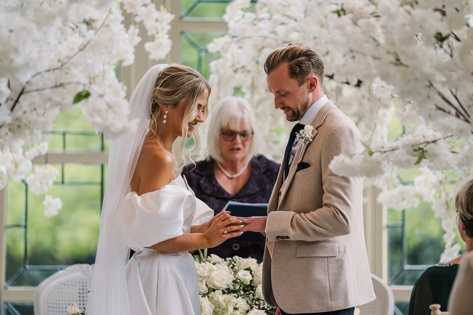 Exchanging the rings at Highcliffe Castle Wedding 