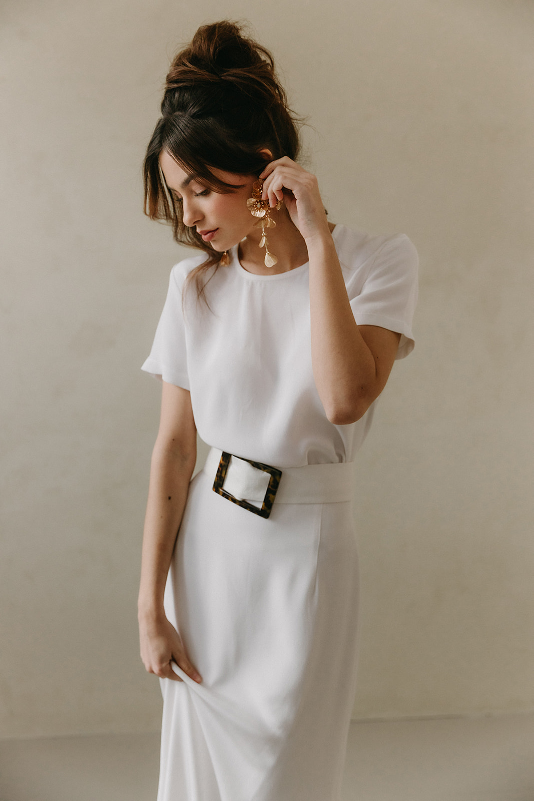 classy and minimal bridal t-shirt top and skirt with a belt. Bridal look with zara earrings kate middleton