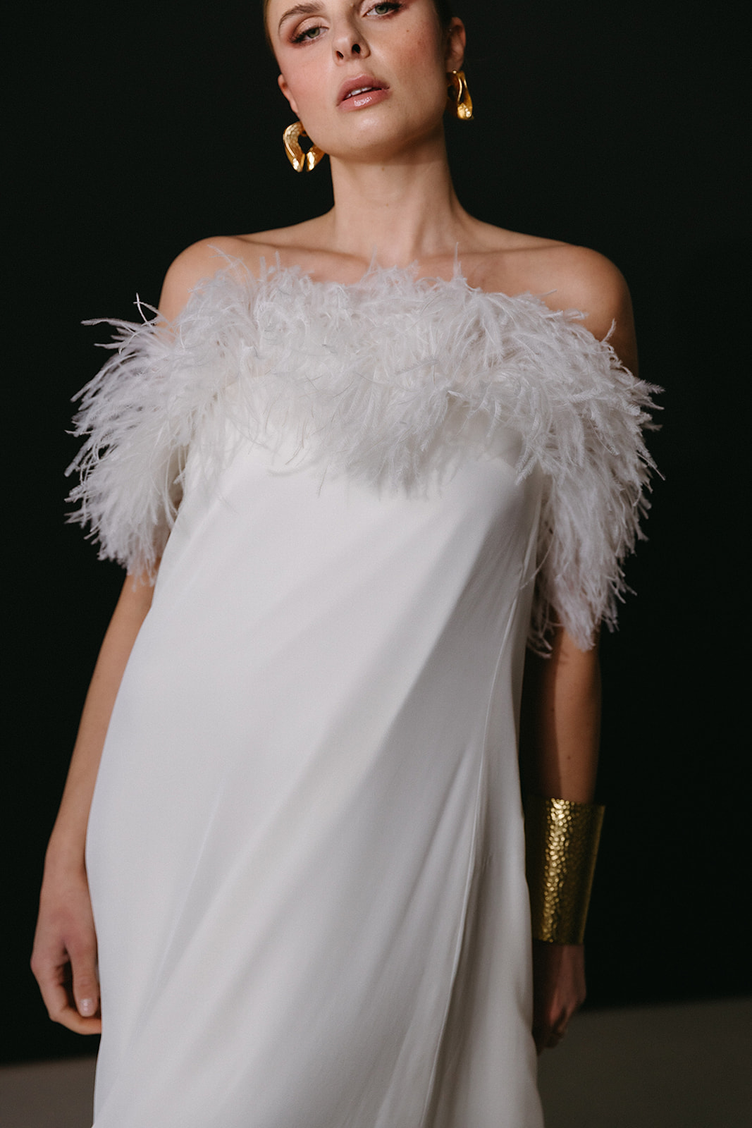 minimal and elegant Bridal dress with feathers