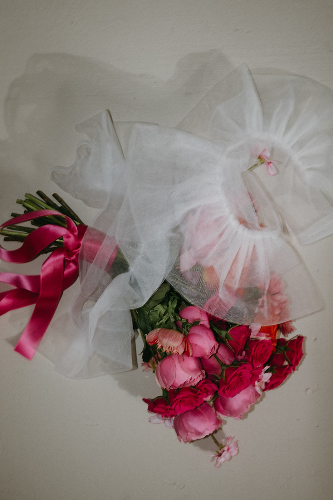 Pink bridal bouquet with bridal gloves