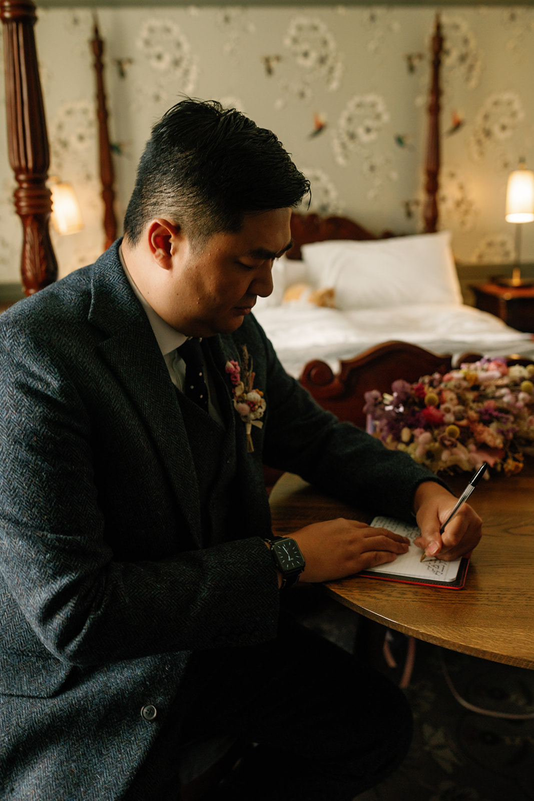 Andrew deep in thought, writing his vows for his intimate elopement at the stunning Isle of Skye.