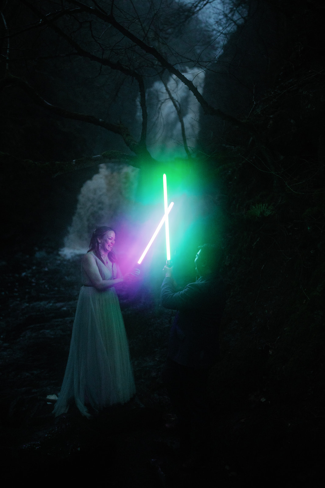 Mellie and Andrew enjoyed their evening photoshoot while holding Star Wars light sabers as props.