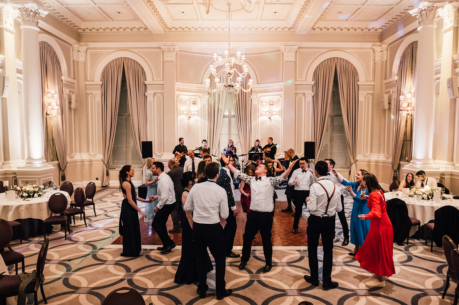 Guests enjoying the dance floor at a London Winter Wedding at Corintha Hotel