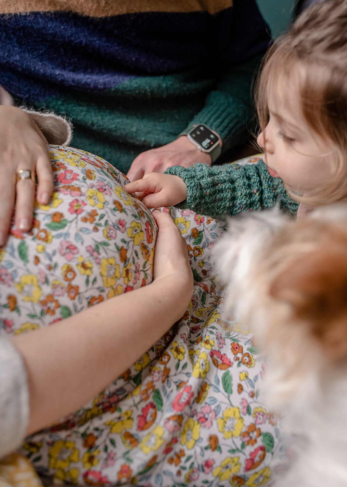 a girl touching with her finger pregnancy tummy during the natural maternity photography by agi lebiedz