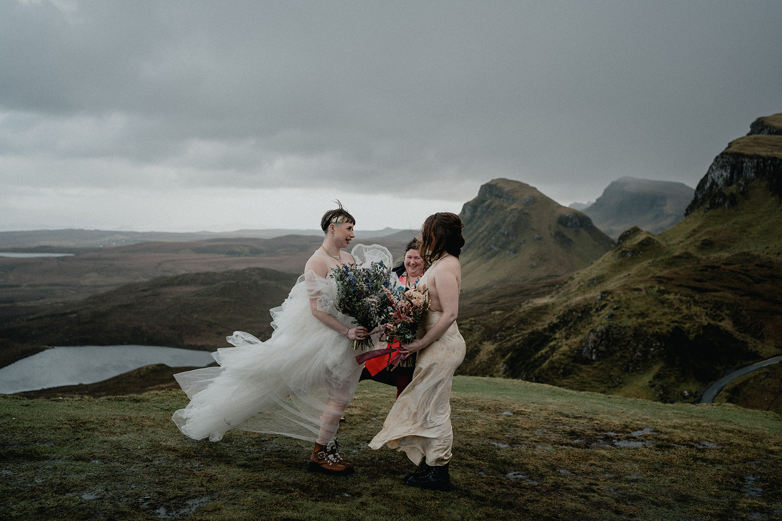 LGBTQI couple stand atop of the Quairaing during their Isle of Skye Scotland elopement
