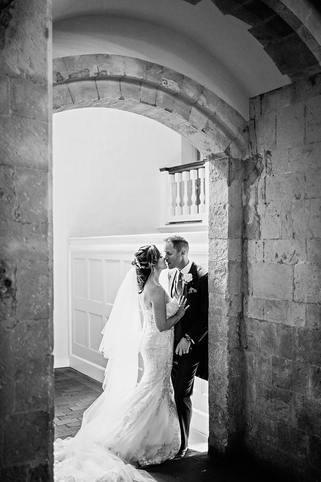 Bride and Groom in doorway Farnham Castle