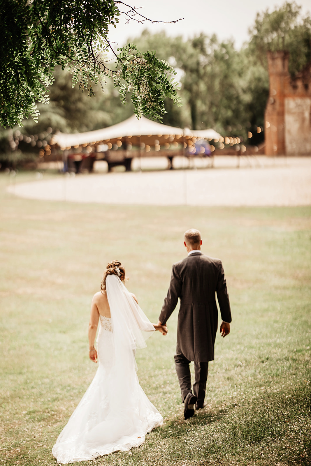 Bride and Groom walking back to Farnham Castle