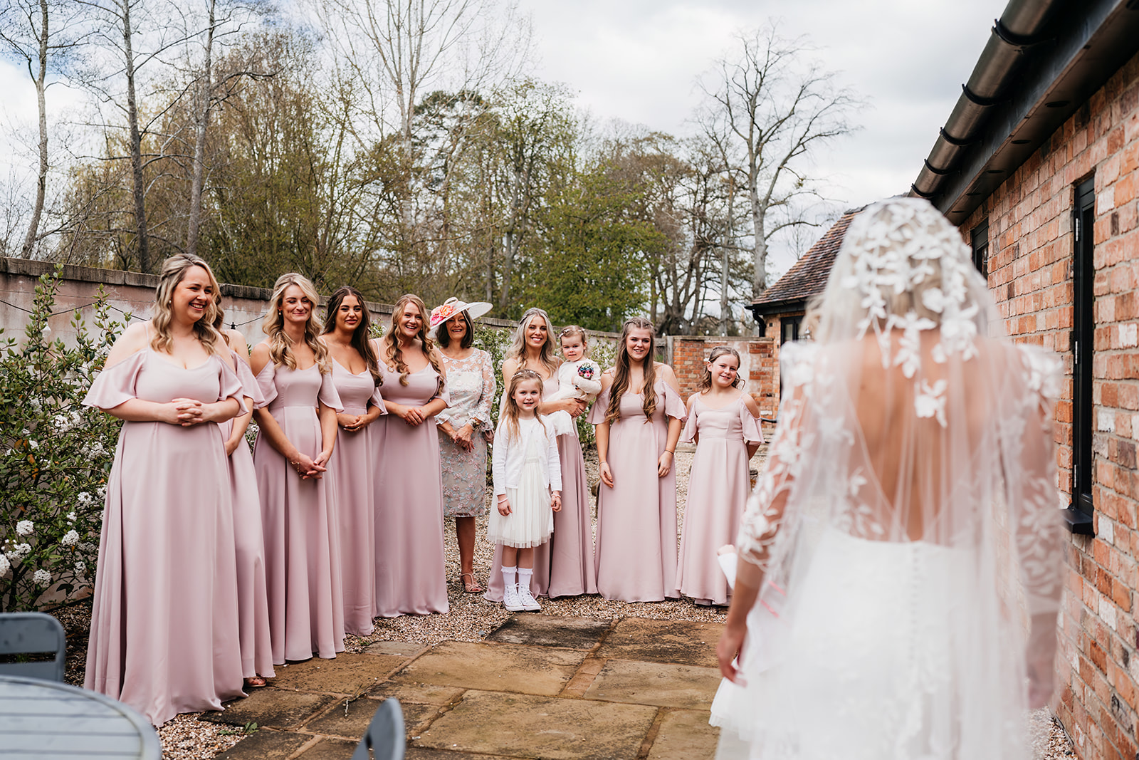 first look with bridesmaids at Barns & Yard