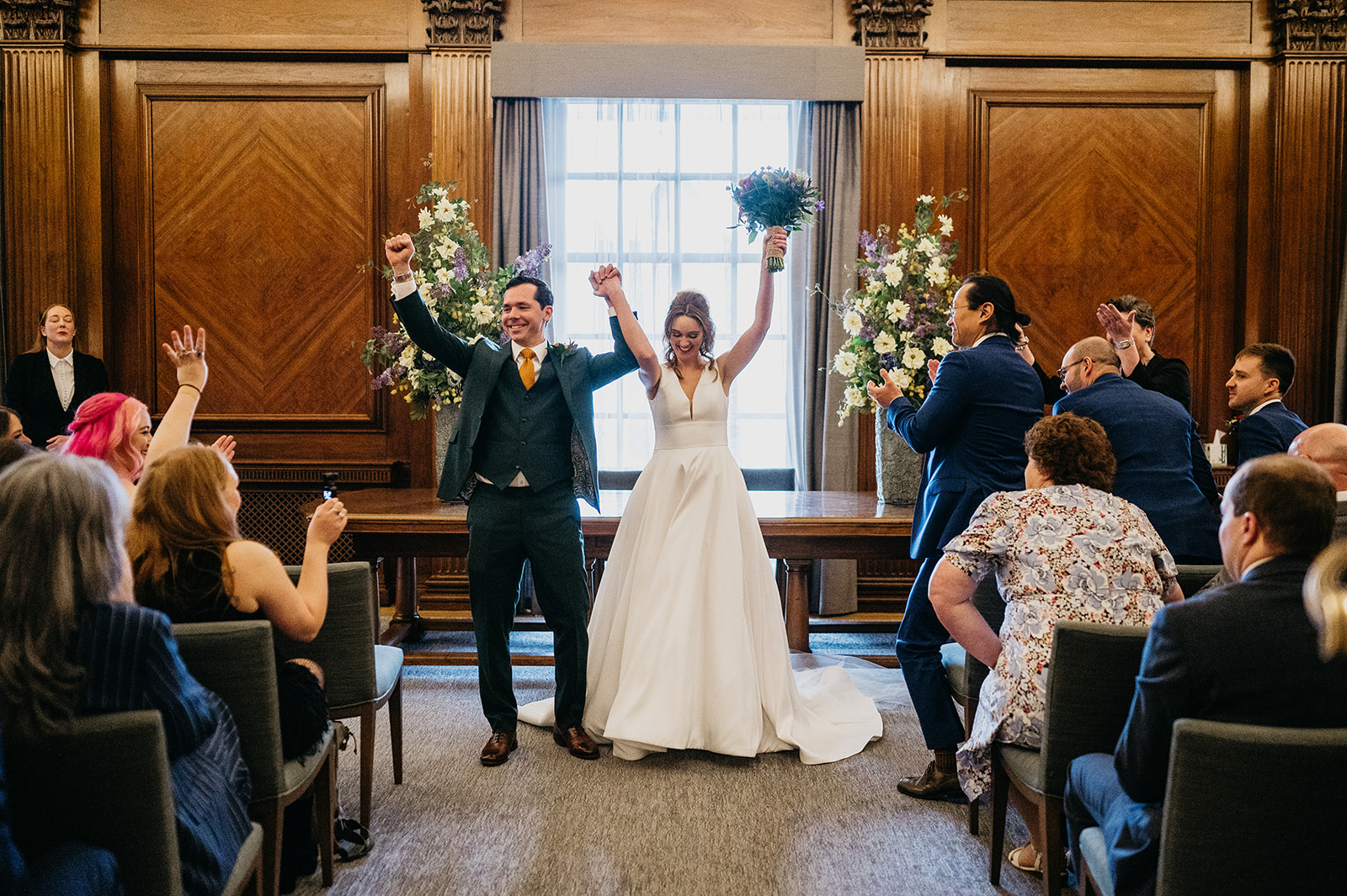 bride and groom celebrate at Old Marylebone Town Hall London 