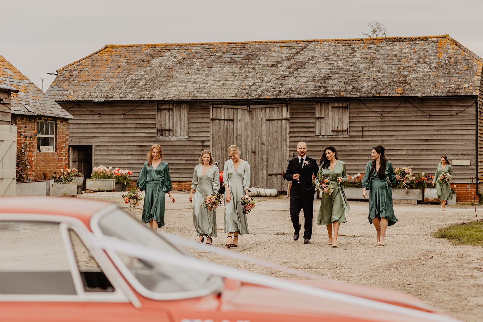 Bride and bridesmaids at a Secret Barn Wedding, West Sussex. By Olive Joy Photography