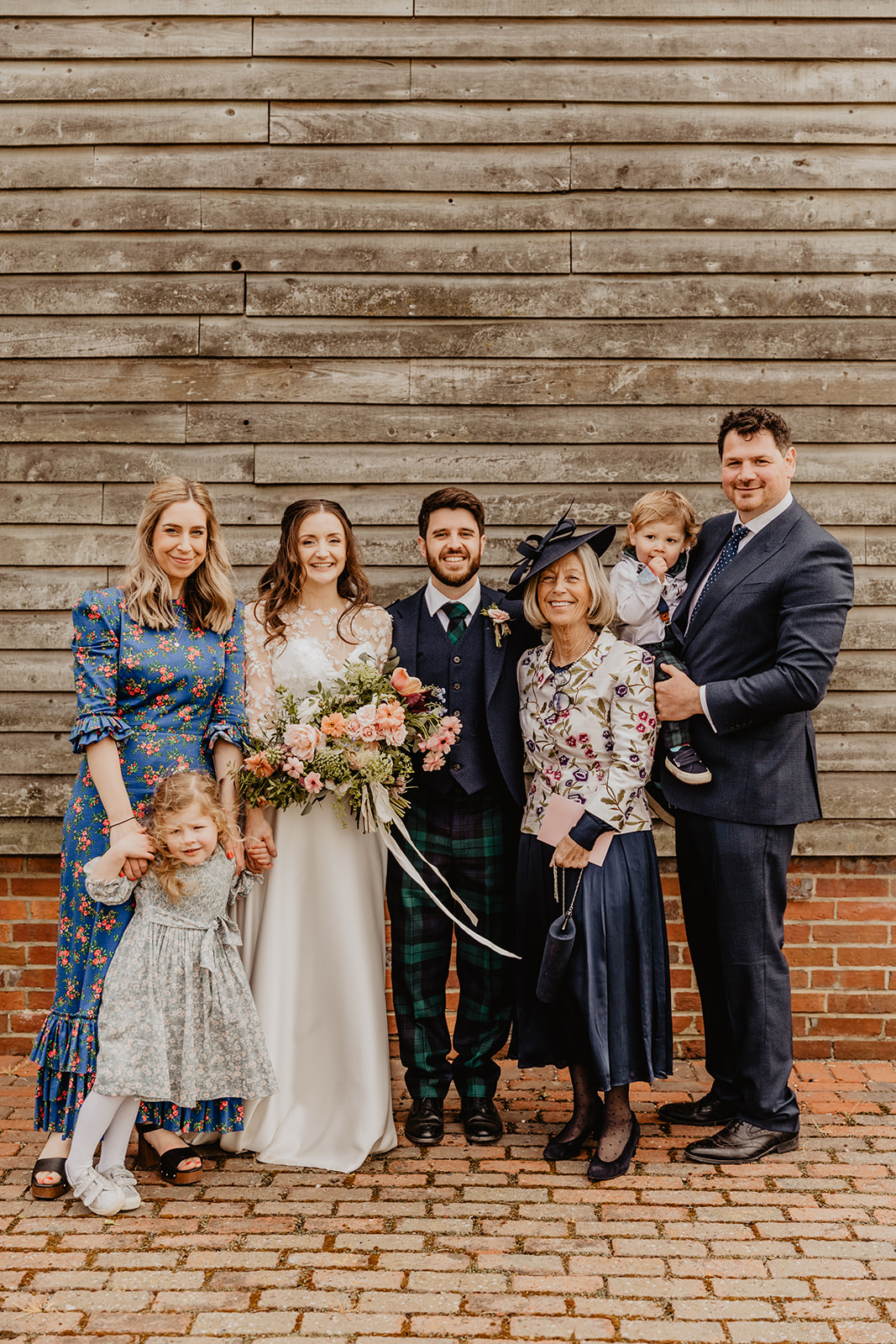 Bride and groom with guests at a Secret Barn Wedding, West Sussex. By Olive Joy Photography