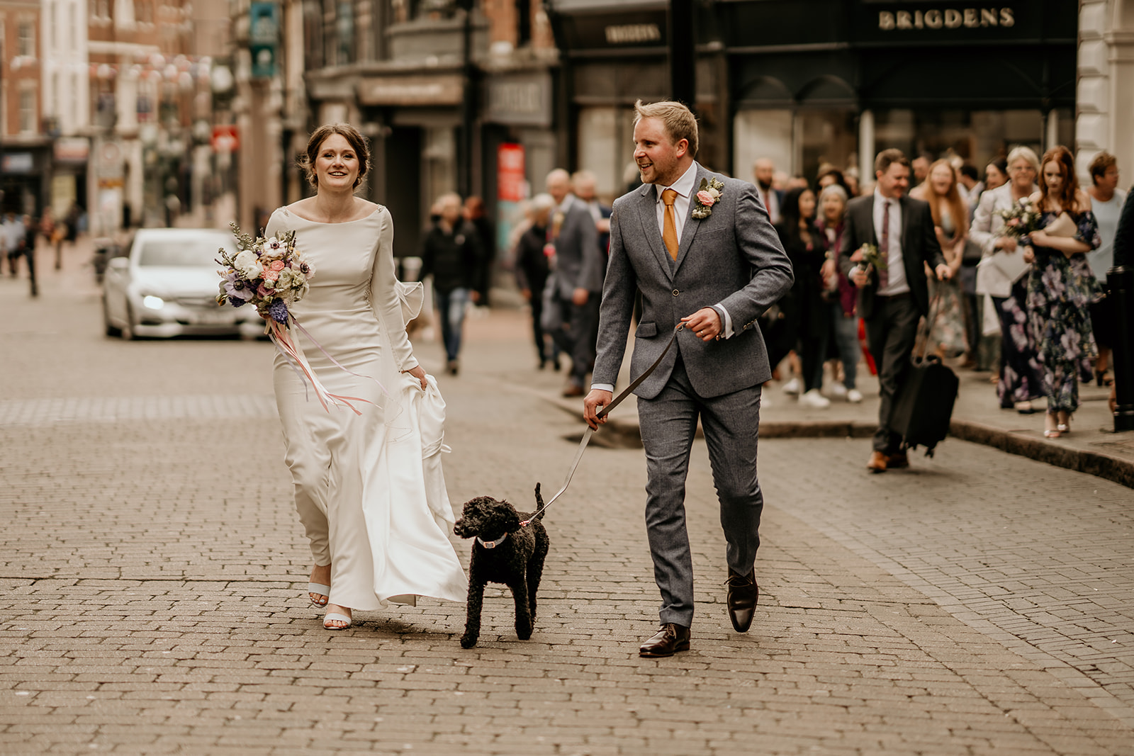 bride and groom with dog in derby