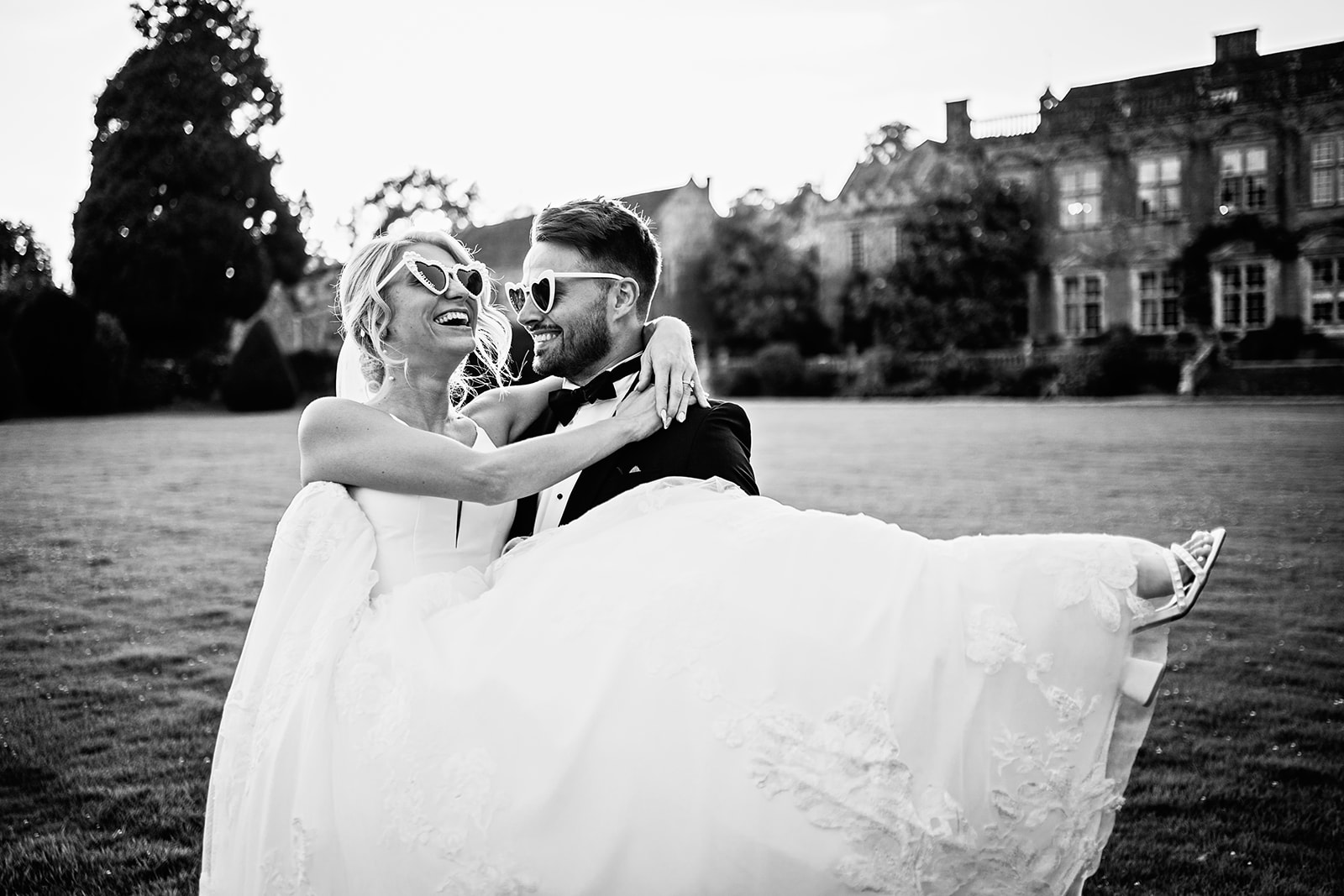 Bride and Groom wearing white sunglasses Brympton House