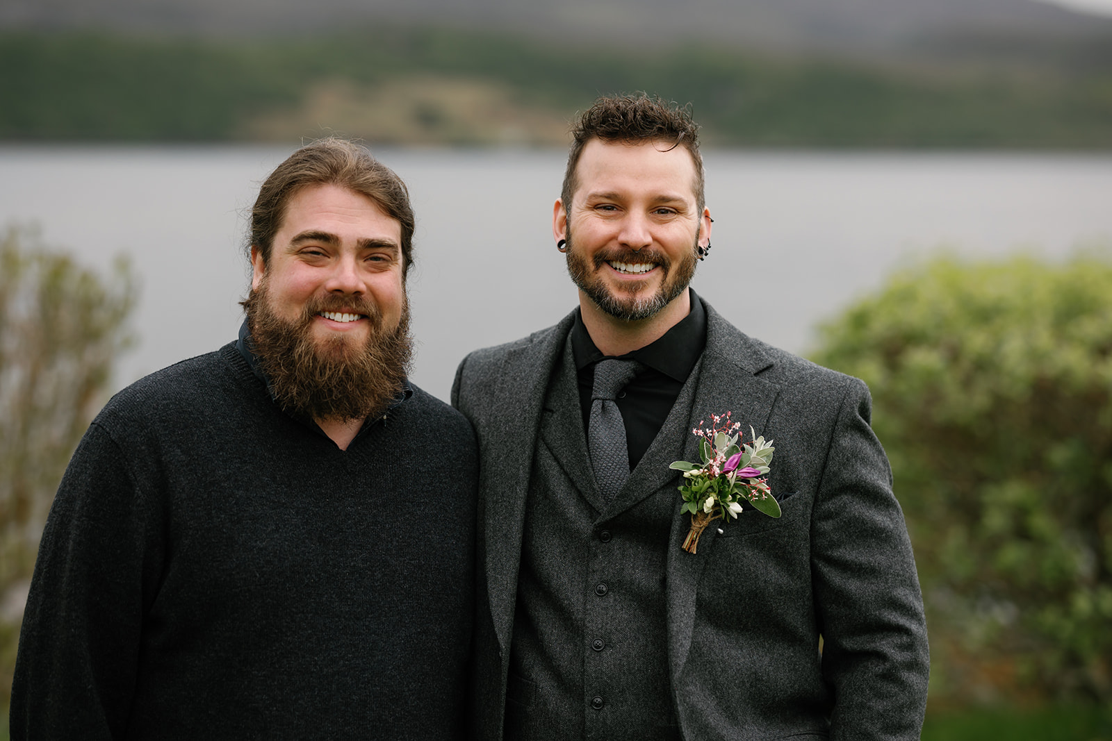 Groom Nick, flanked by his best man and officiant Wes, shares a dram of local Skye whisky, Talisker