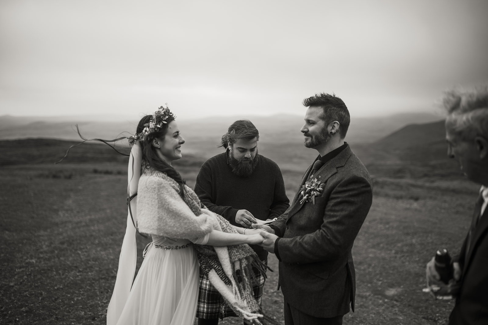A moment of pure connection: Becca and Nick exchange vows amidst the stunning natural beauty of the Isle of Skye.