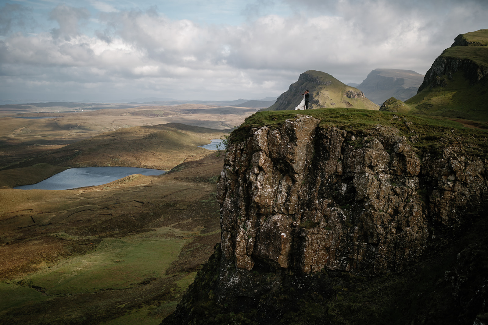 Nick and Becca, amidst the captivating Quiraing, share a moment of connection and love during their elopement photoshoot