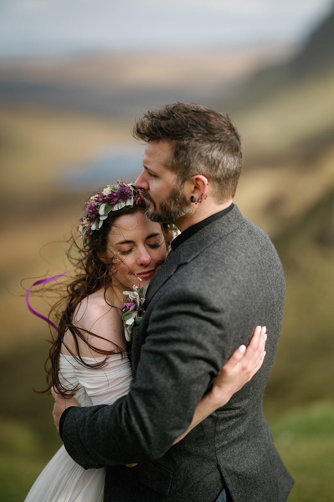 Becca and Nick, surrounded by the ancient beauty of Quiraing, find solace in each others arms during their elopement day