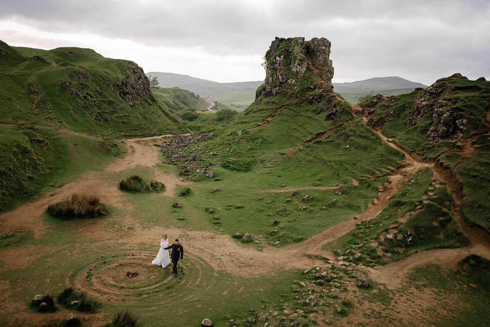 Becca and Nick as they share a tender moment, wrapped in the ethereal beauty of Fairy Glen