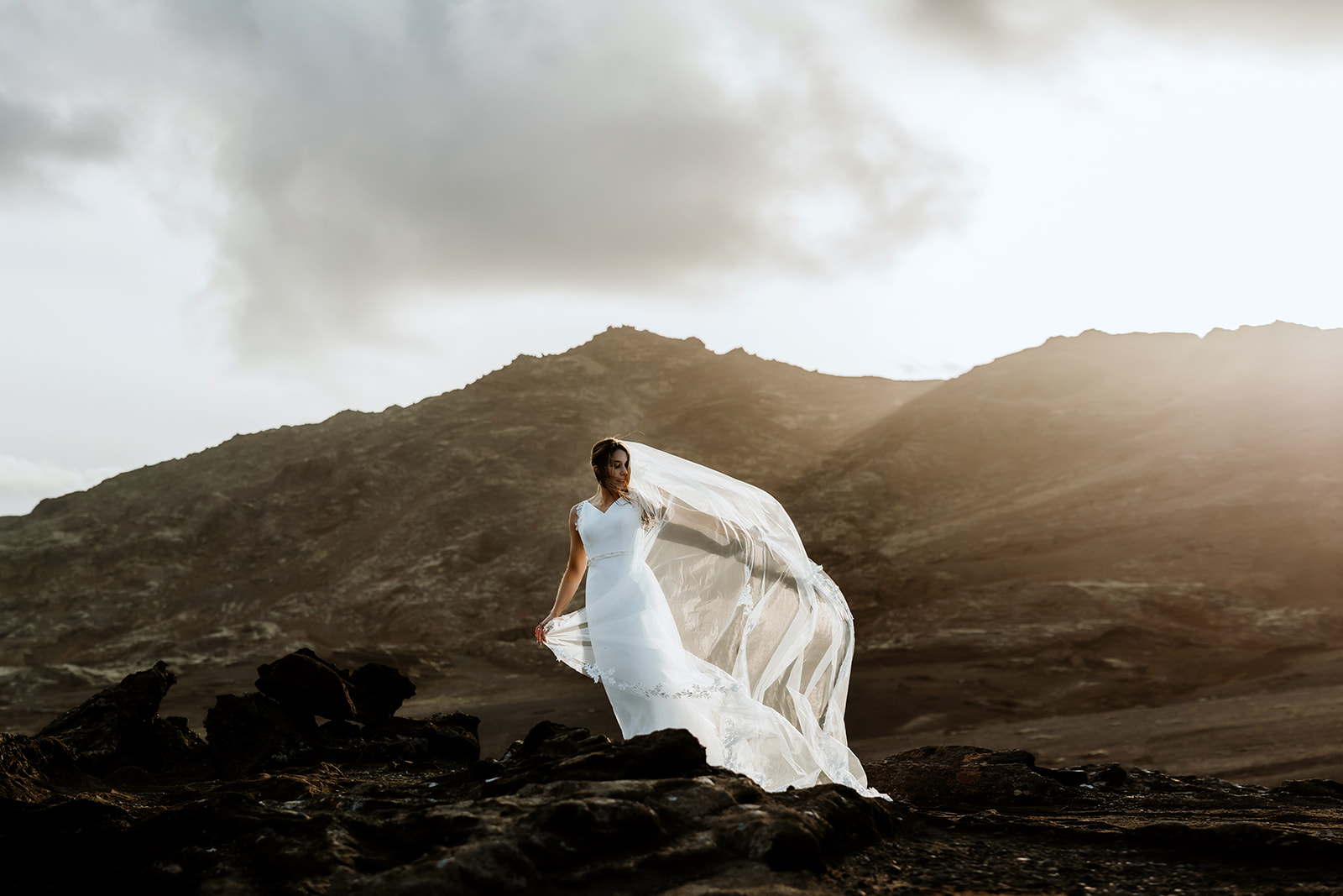 Couple portrait in the midnight sun of a bride and groom who eloped in Iceland
