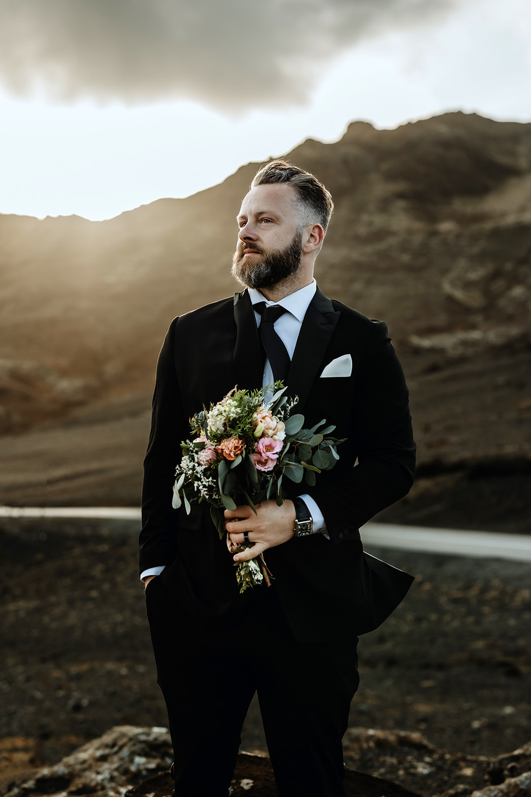 Couple portrait in the midnight sun of a bride and groom who eloped in Iceland
