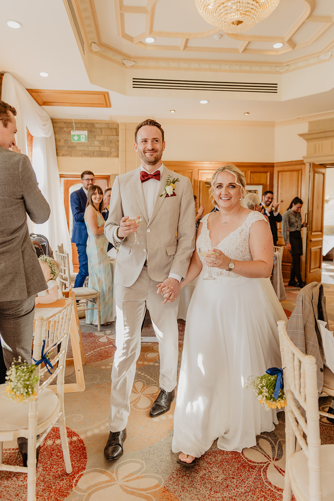 Bride and groom arriving at their reception at a South Lodge, Sussex Wedding. By Olive Joy Photography