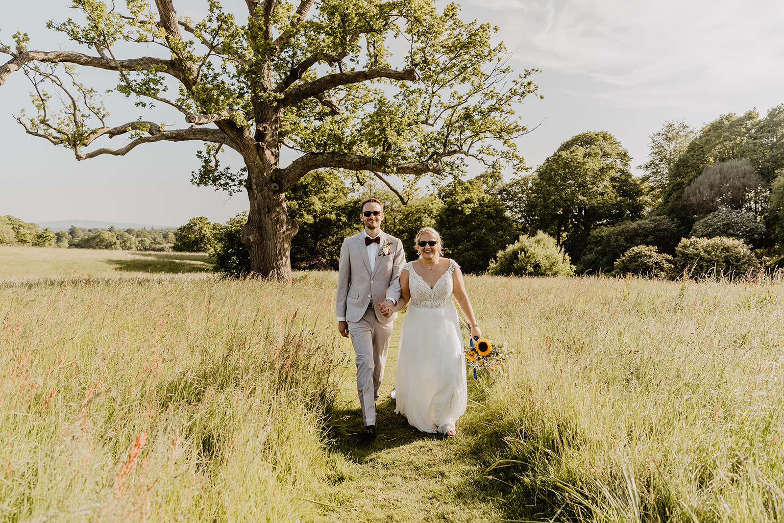 Bride and groom outside at a South Lodge, Sussex Wedding. By Olive Joy Photography