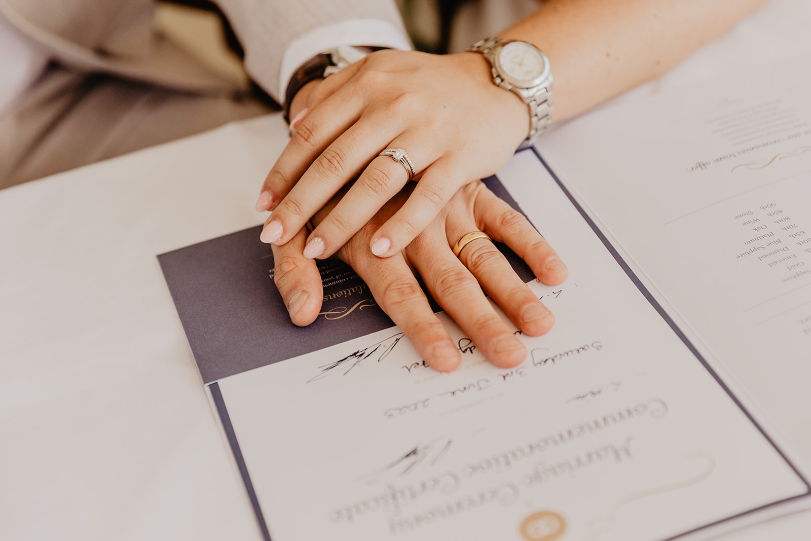 Bride and Groom's hands on the register at a South Lodge, Sussex Wedding. By Olive Joy Photography