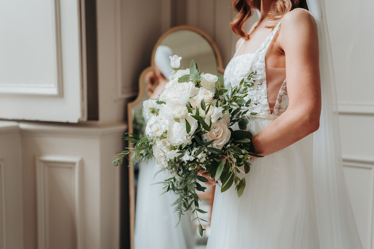 Bride at Brympton House holding flowers