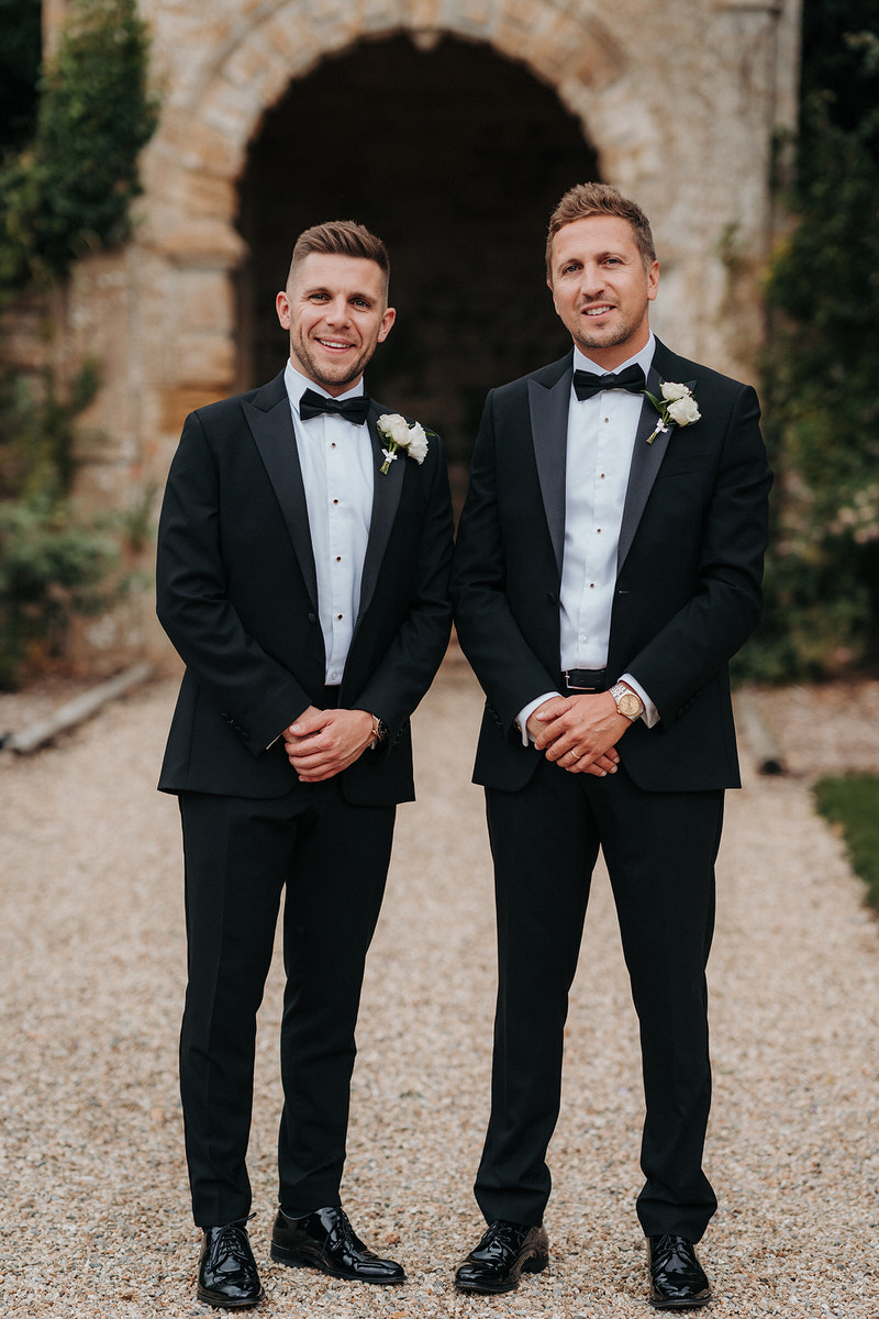 Brympton House groom and best man posing for photographer