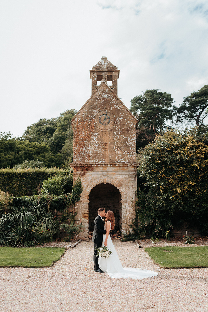 Brympton House wedding photographer with the clock tower