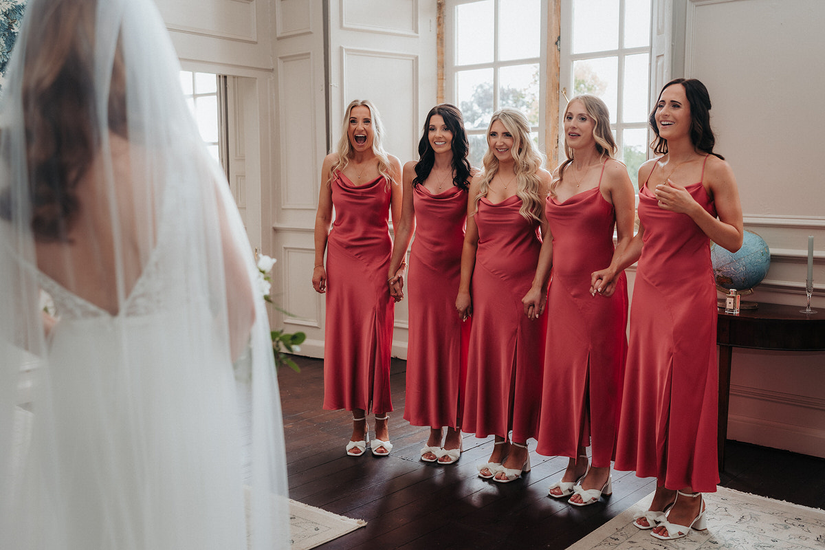 Reveal with bridesmaids at Brympton House . First look