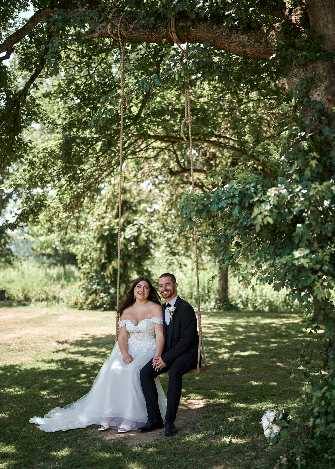 Newly Weds on Swing at Houchins Wedding Venue