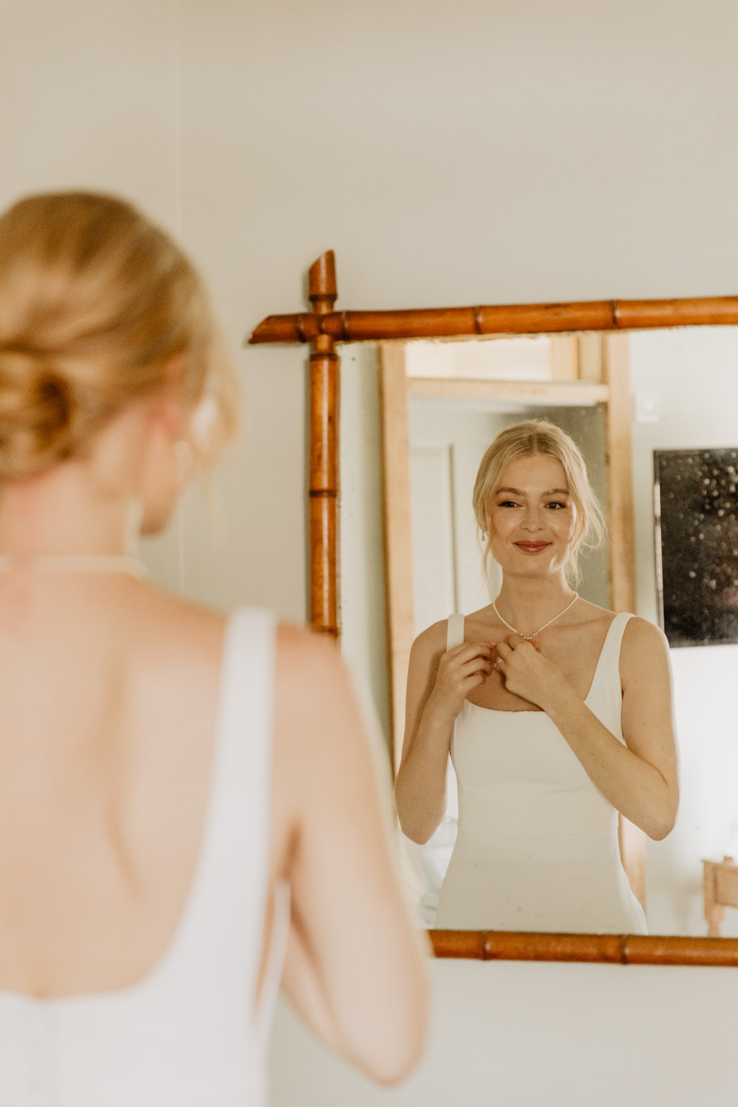 Bride getting ready at a Bury Manor Barn Wedding in Sussex. Photographer OliveJoy Photography.