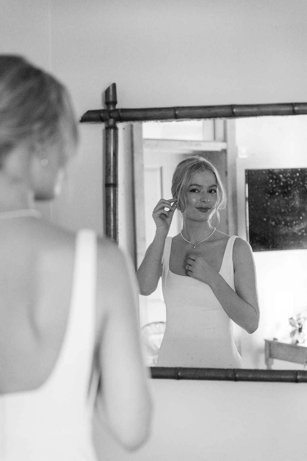 Bride getting ready at a Bury Manor Barn Wedding in Sussex. Photographer OliveJoy Photography.