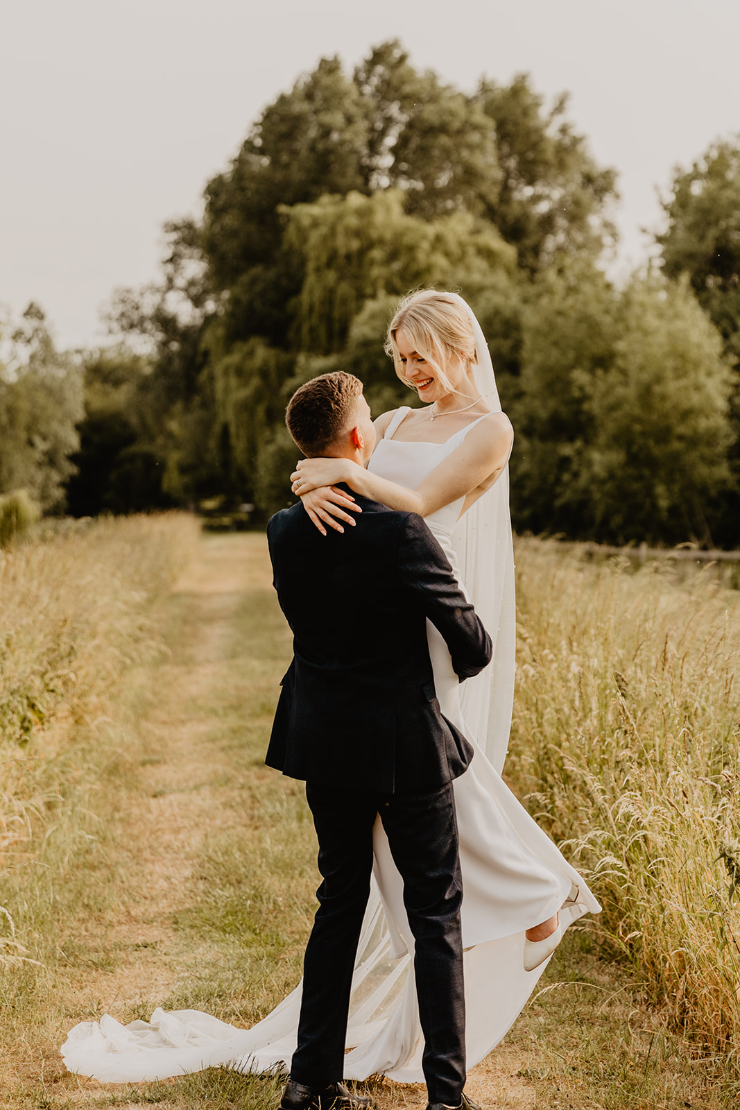 Bride and Groom golden hour photos at a Bury Manor Barn Wedding in Sussex. Photographer OliveJoy Photography.