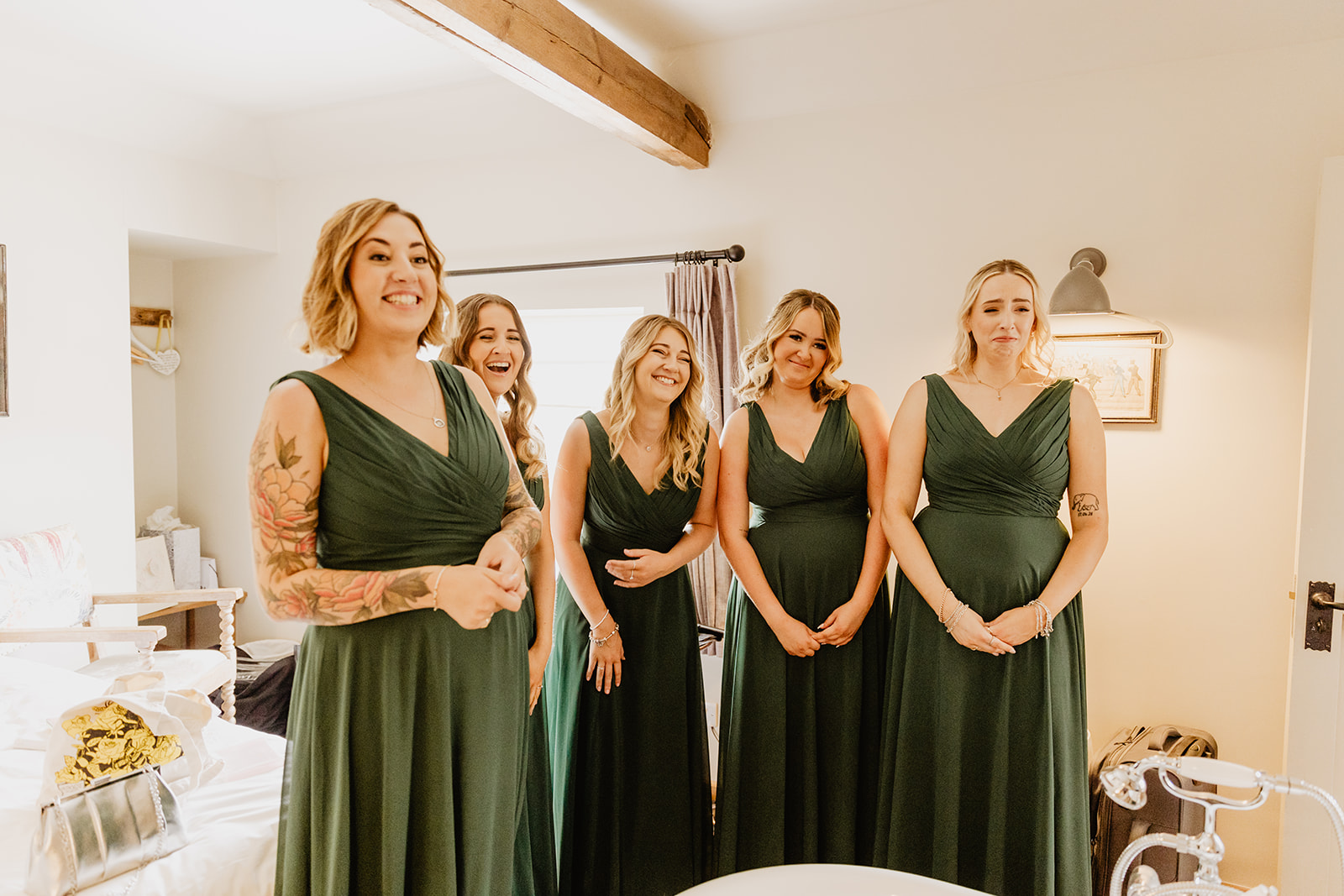 Bride and her bridesmaids getting ready at a Bury Manor Barn Wedding in Sussex. Photographer OliveJoy Photography.